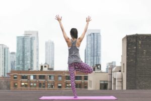 Free woman doing yoga pose